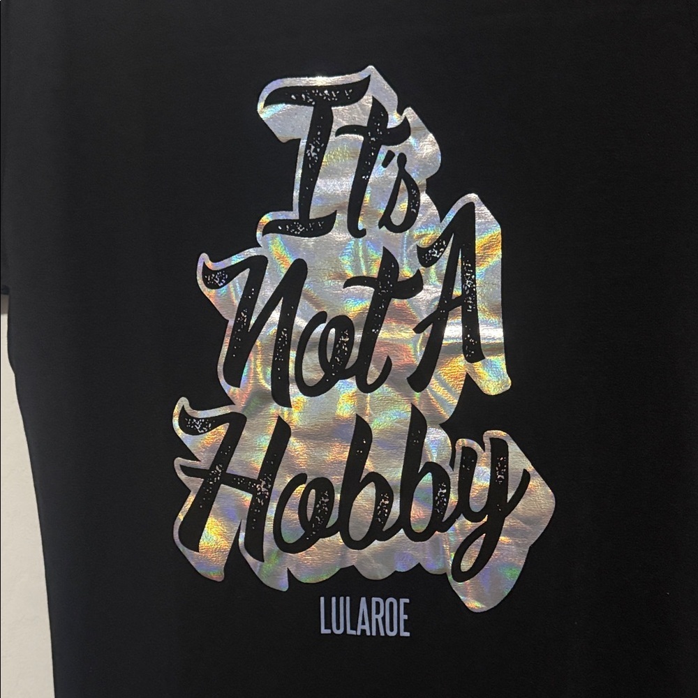LuLaRoe “It’s Not A Hobby” Graphic Tee | XS Black Holographic Logo | NWT - Picture 2 of 8